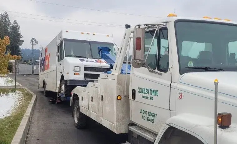Truck towing a fed EX truck